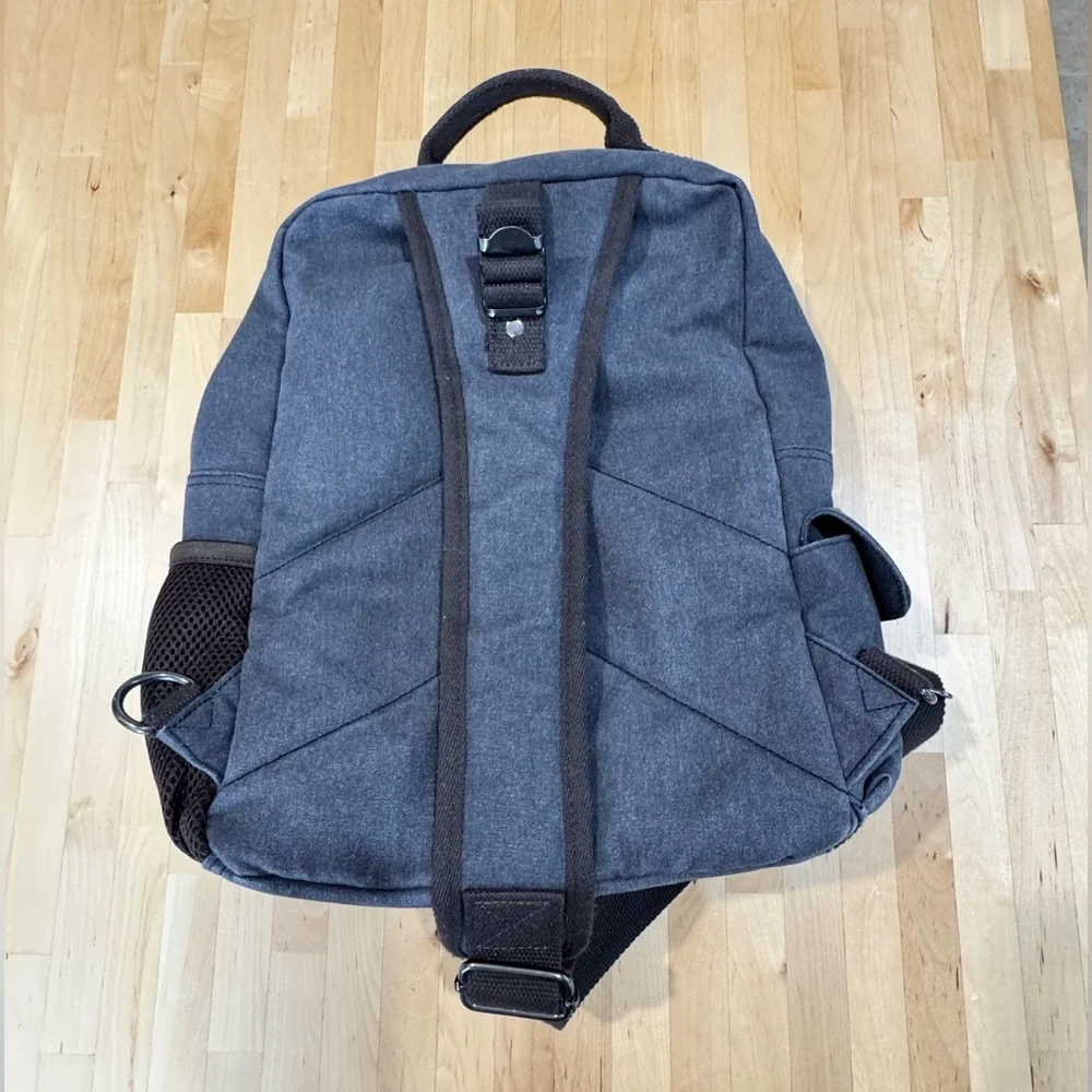 Gray Canvas Crossbody Backpack with Brown Accents Multiple Compartments Durable